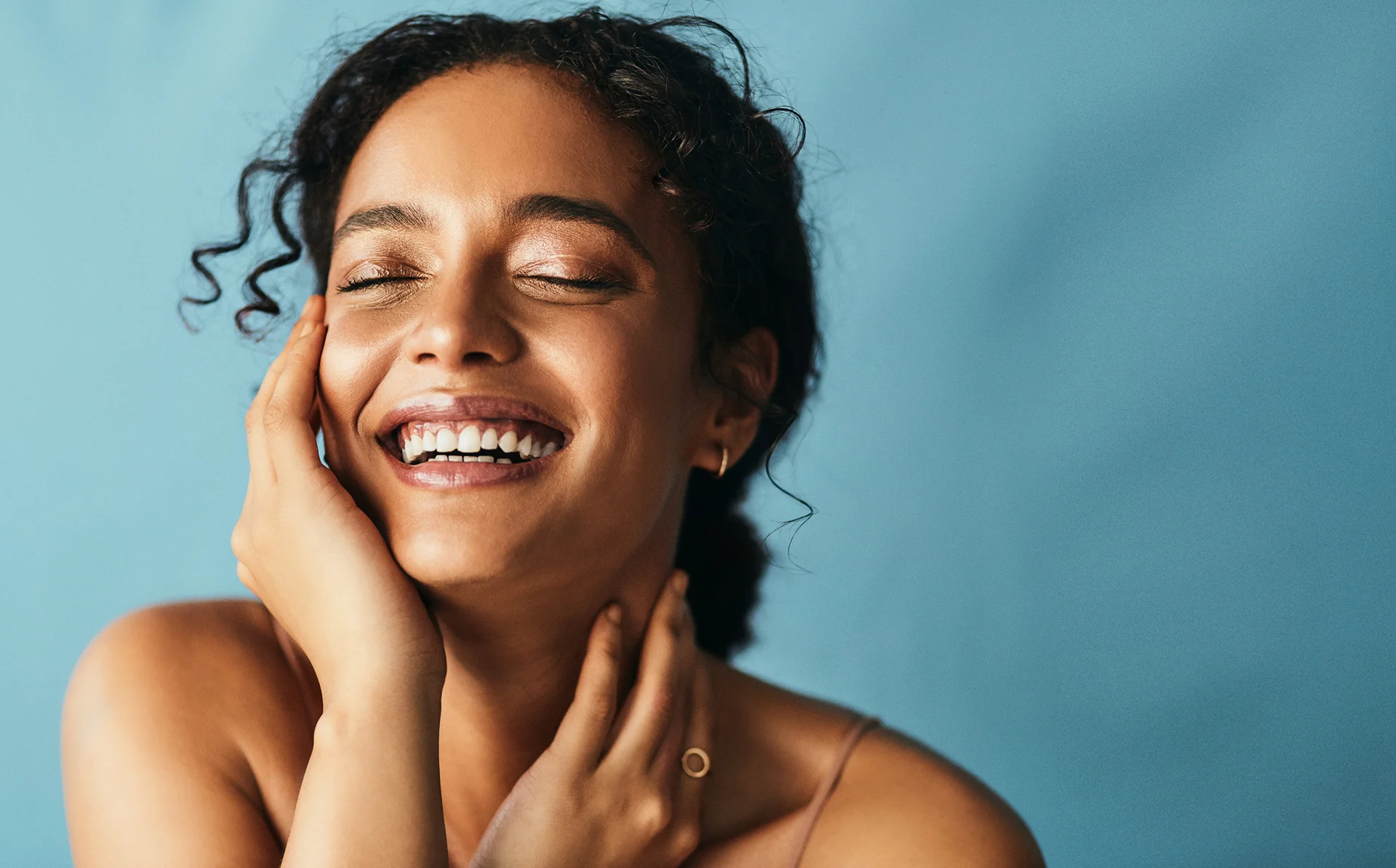 a portrait of a woman with radiant skin after hyperpigmentation treatment