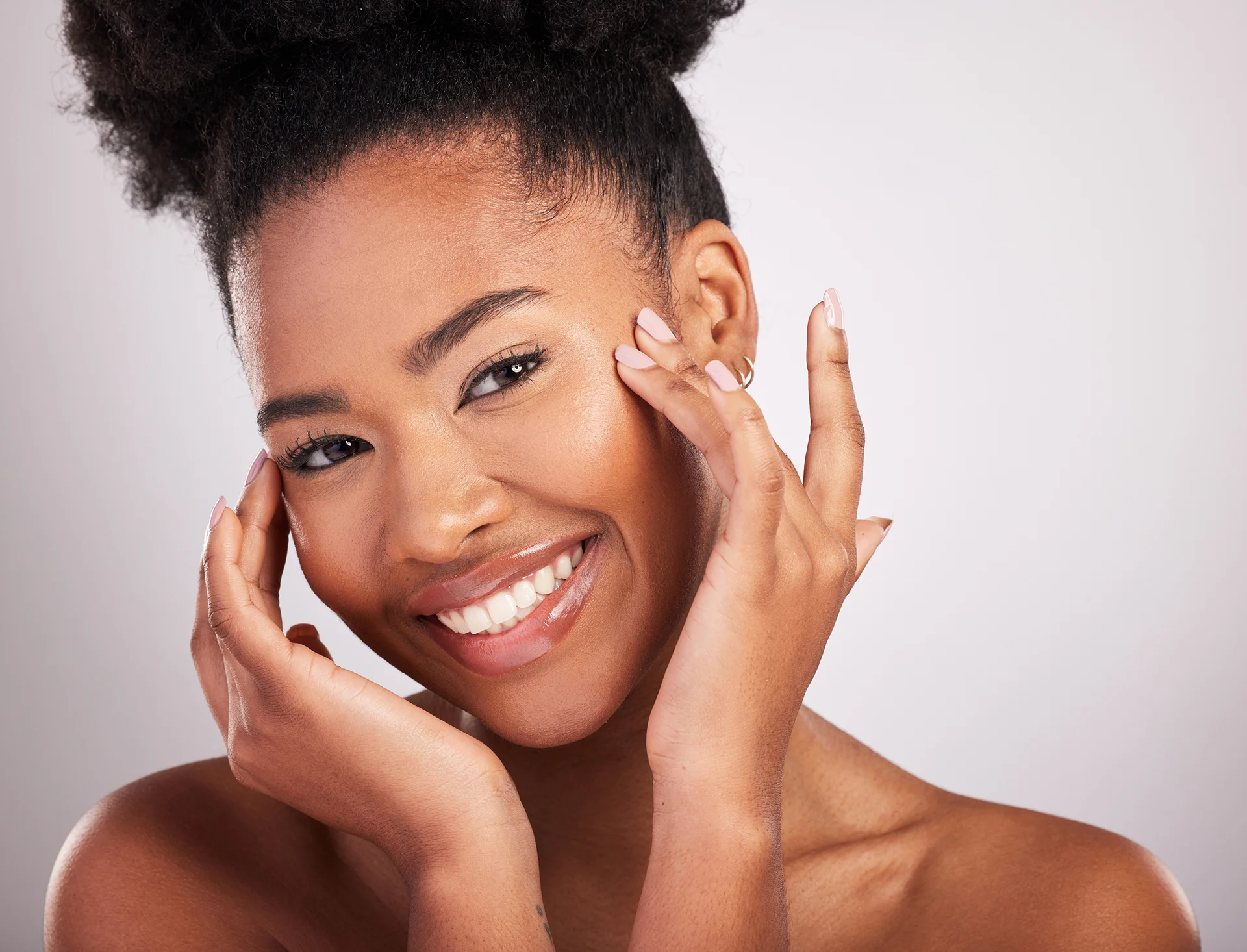 a portrait of a woman with smooth, clear skin after dark spot removal treatments