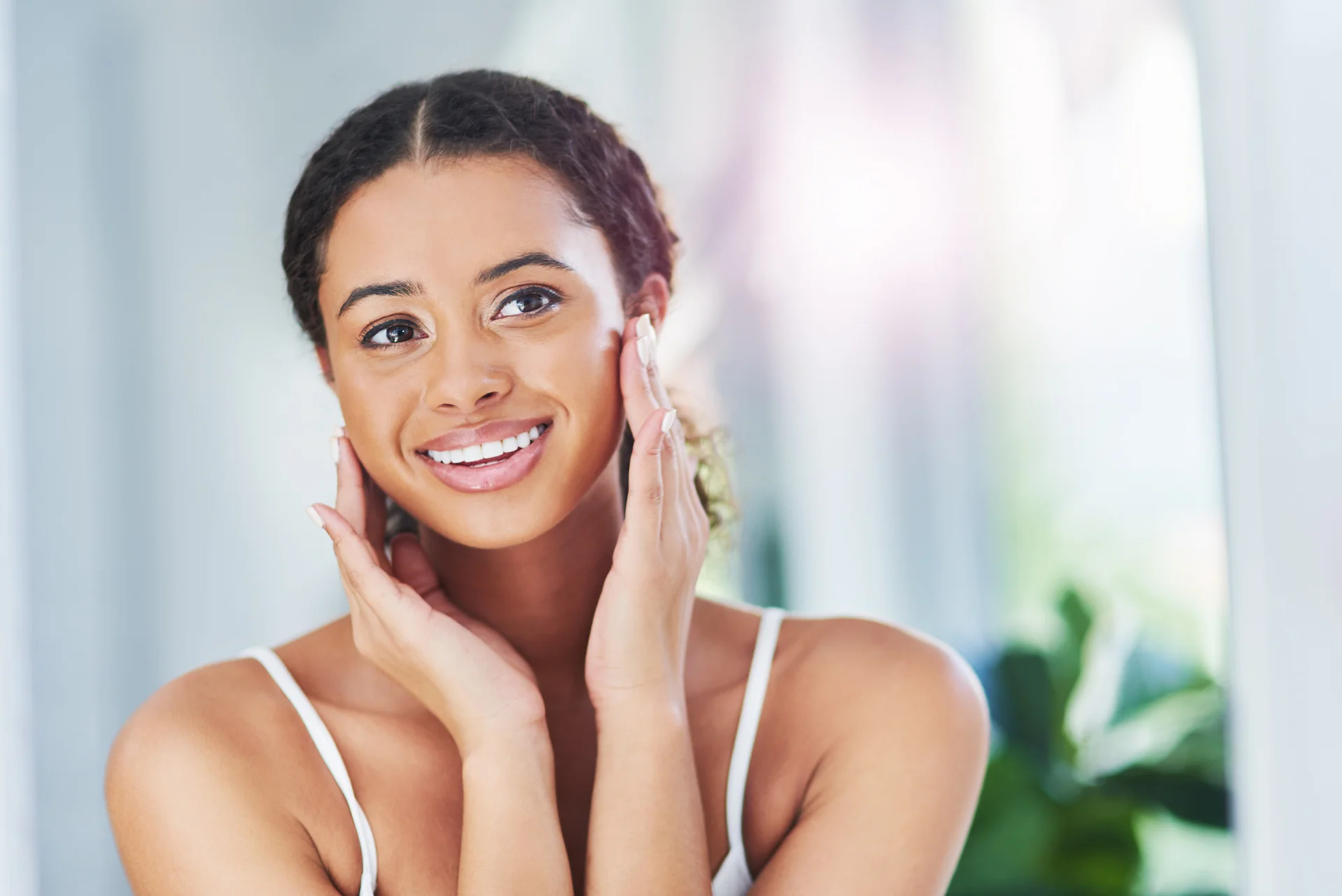 an afro-american woman with smooth, even complexion after medical spa treatments